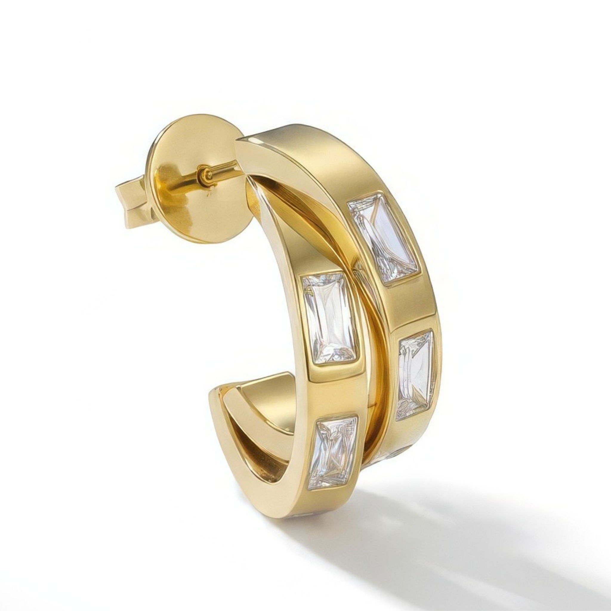 Gold hoop earring with white baguette stones on a white background