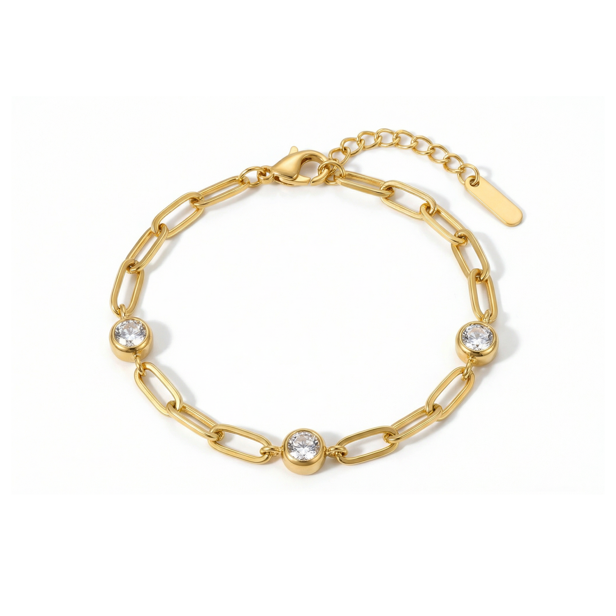 Gold chain bracelet with three diamond-like stones on a white background