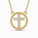 Gold cross necklace with rhinestones on a white background