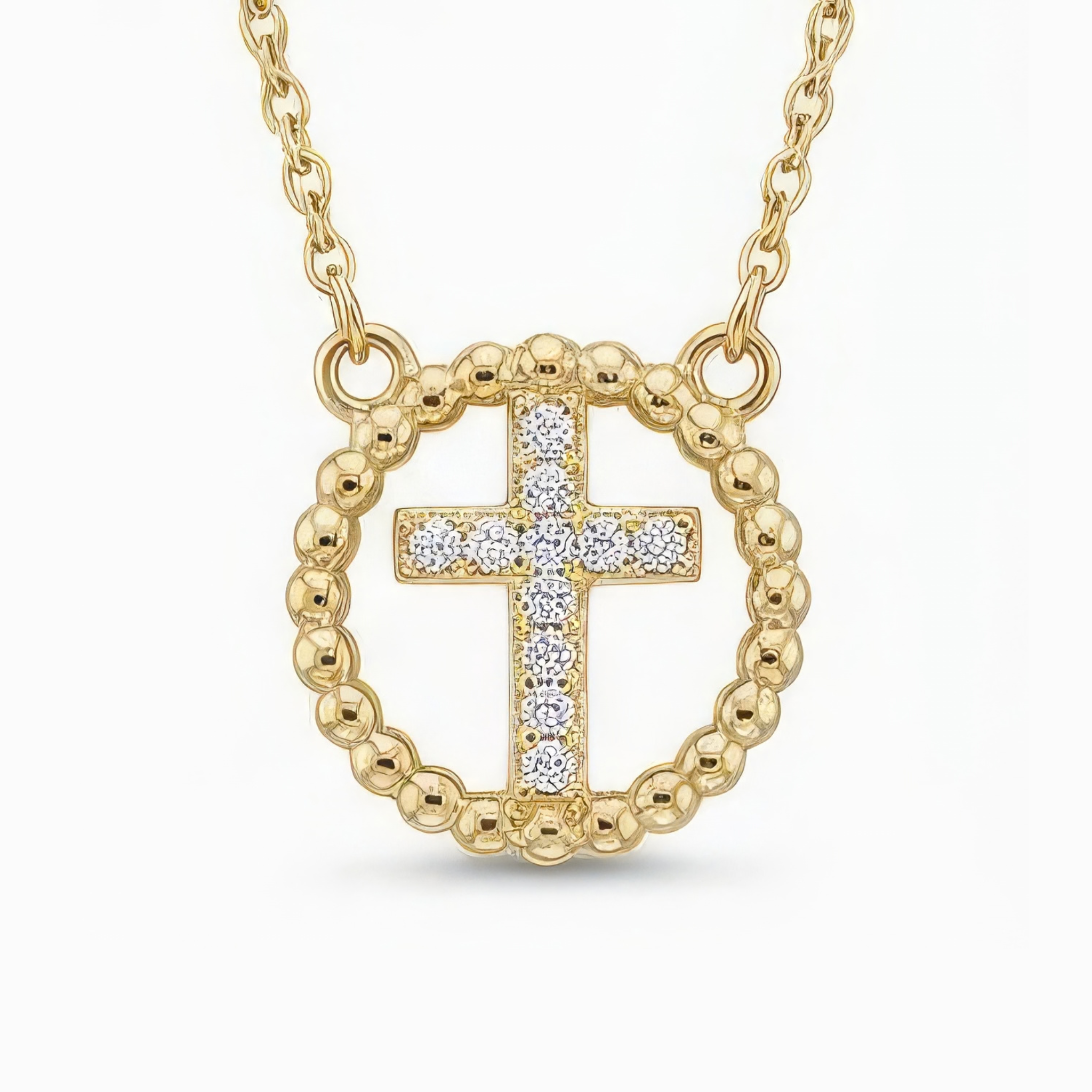 Gold cross necklace with rhinestones on a white background