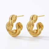 Gold hoop earrings on a white background