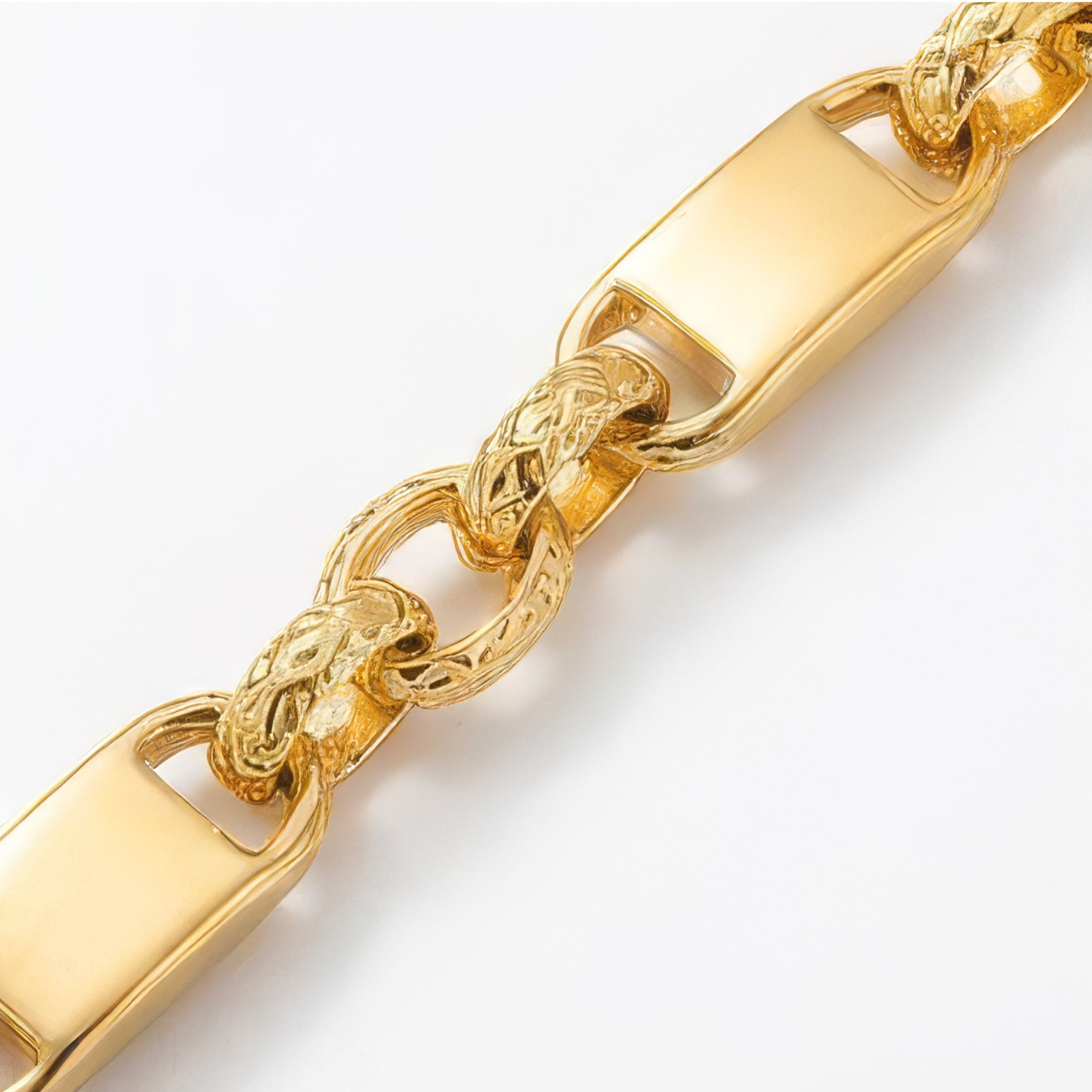 Close-up of a gold chain bracelet on a white background