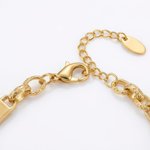 Gold chain bracelet on a white background