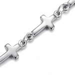 Close up of silver Mini Crosses Bracelet on a white background.