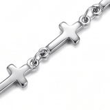 Close up of silver Mini Crosses Bracelet on a white background.