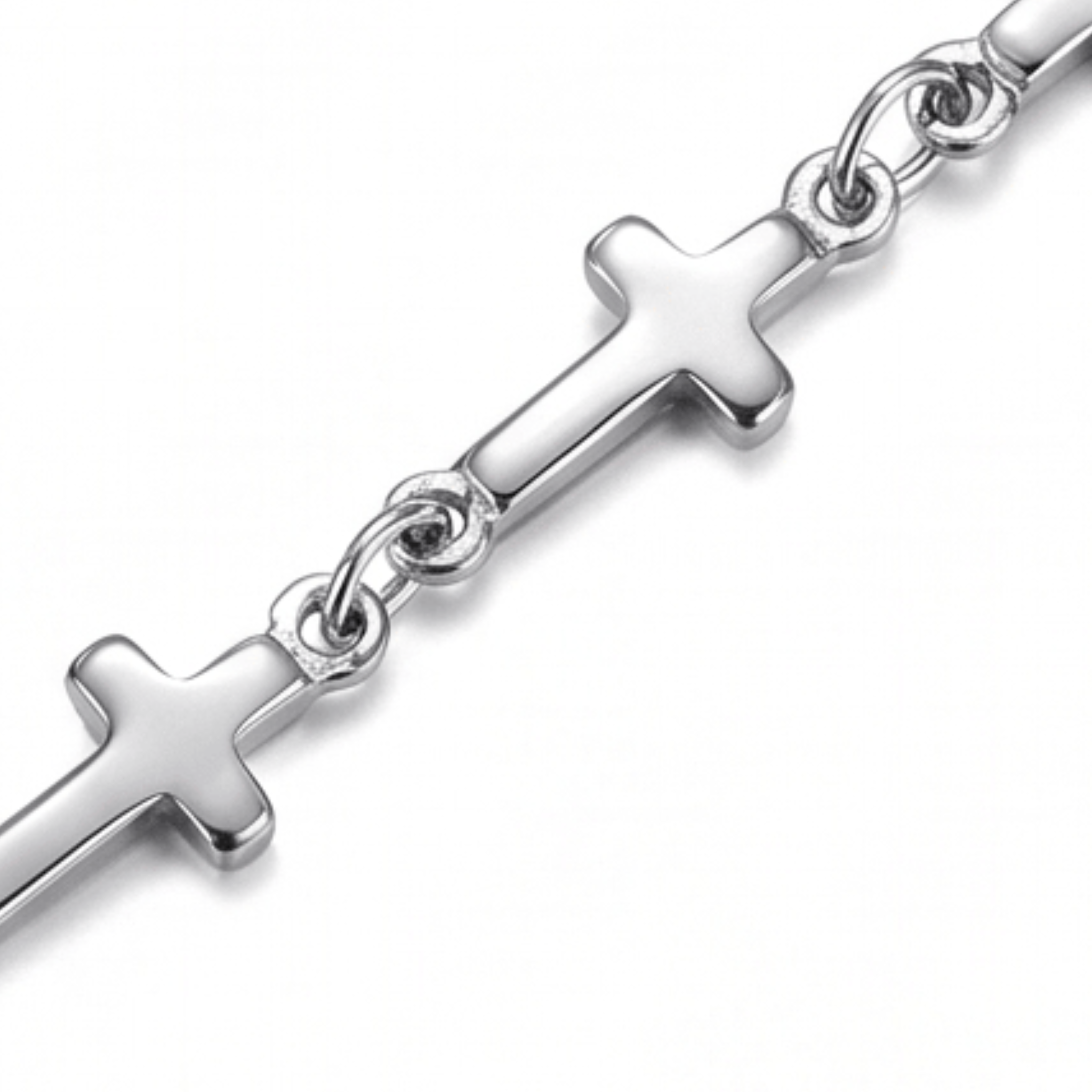 Close up of silver Mini Crosses Bracelet on a white background.
