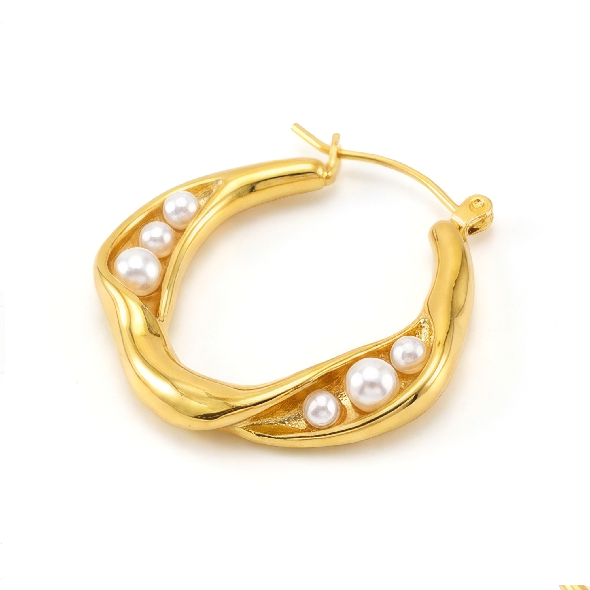 Gold hoop earring with pearls on a white background