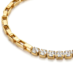 Gold bracelet with clear gemstones on a white background
