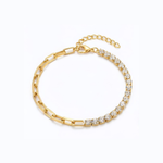 Gold bracelet with clear gemstones on a white background