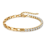 Gold bracelet with clear gemstones on a white background