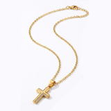 Gold cross necklace on a white background