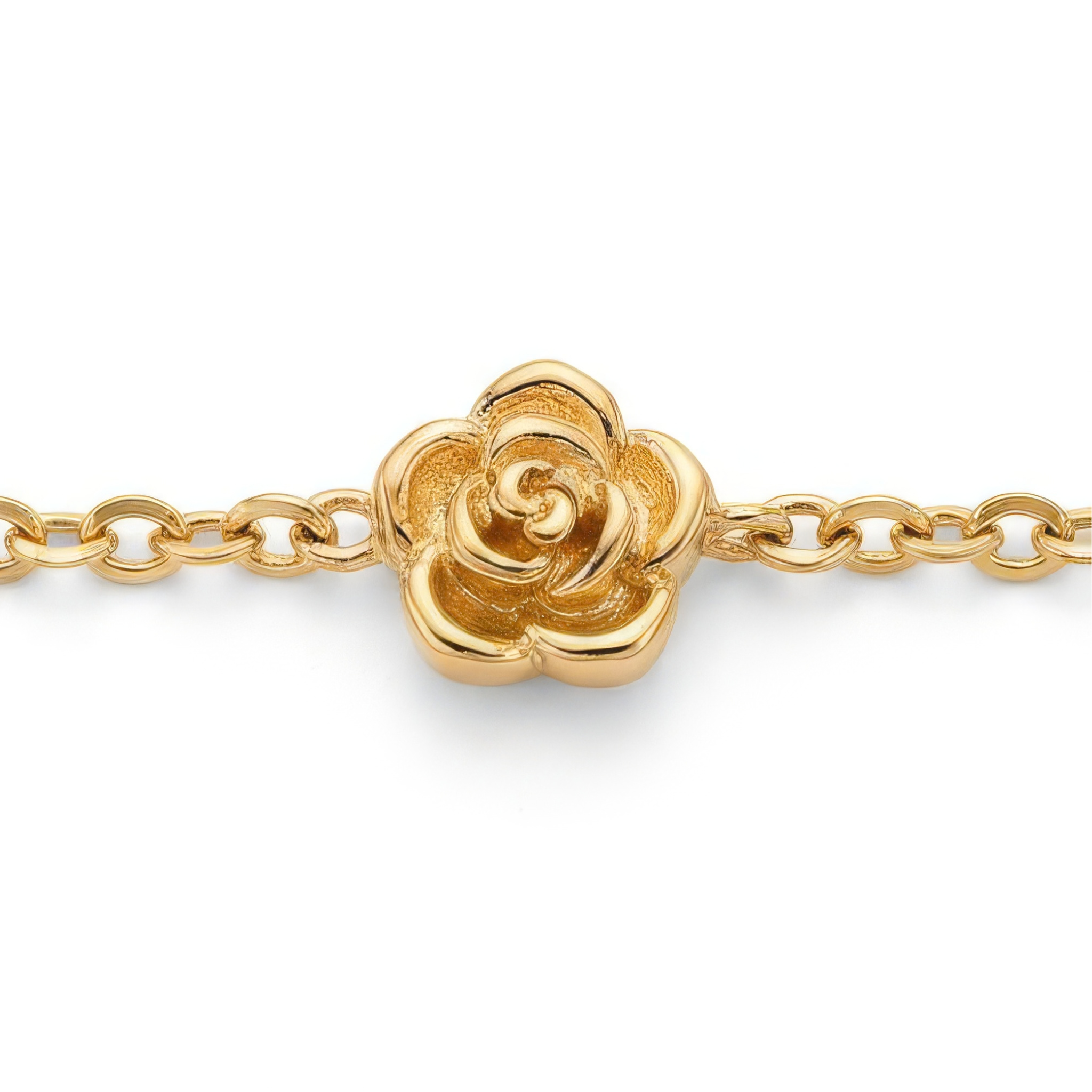 Close up of stationary gold rosebud design on a gold bracelet on a white background