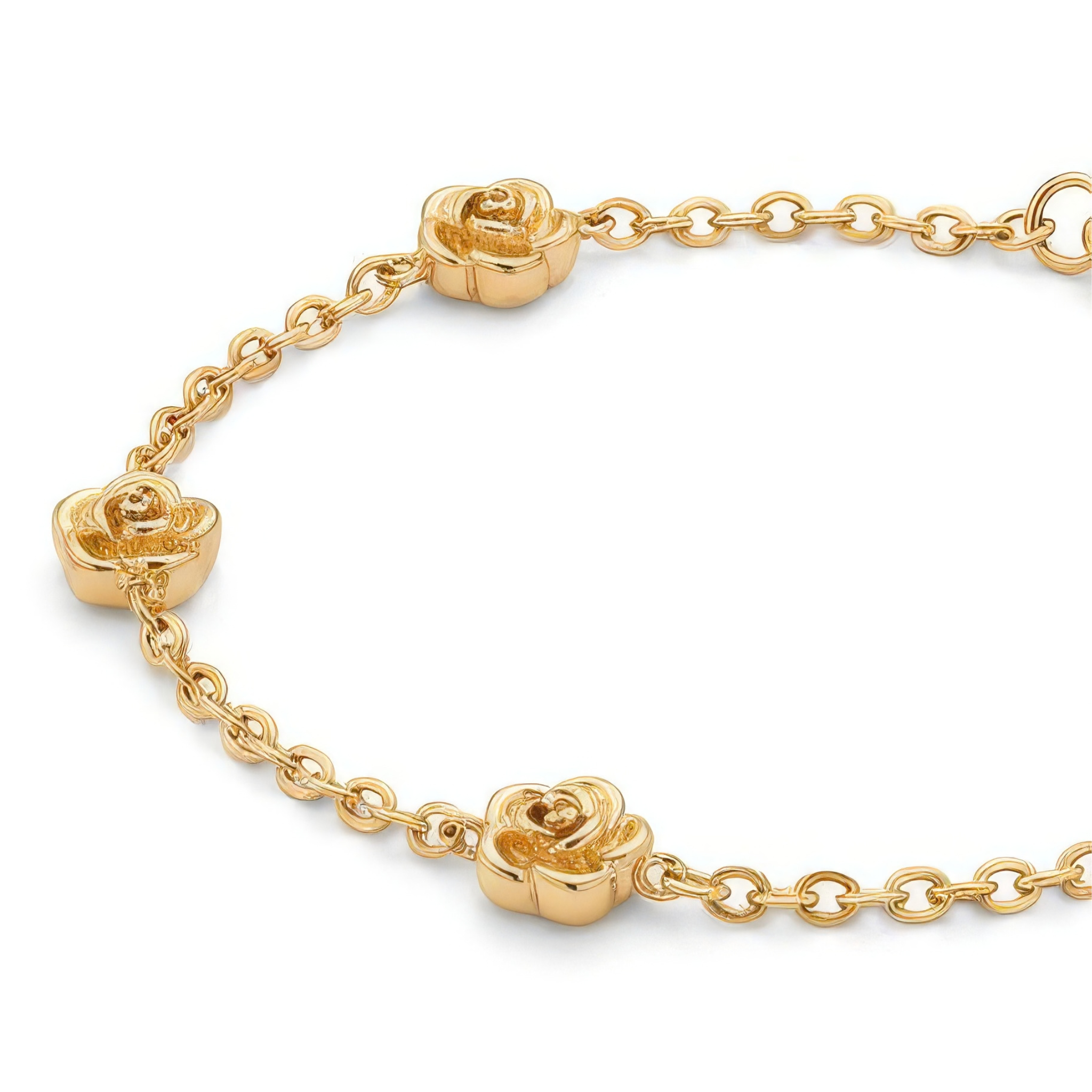 Close up of gold bracelet with stationary gold rosebud designs spaced out on the chain on a white background