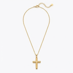 Gold cross necklace on a white background