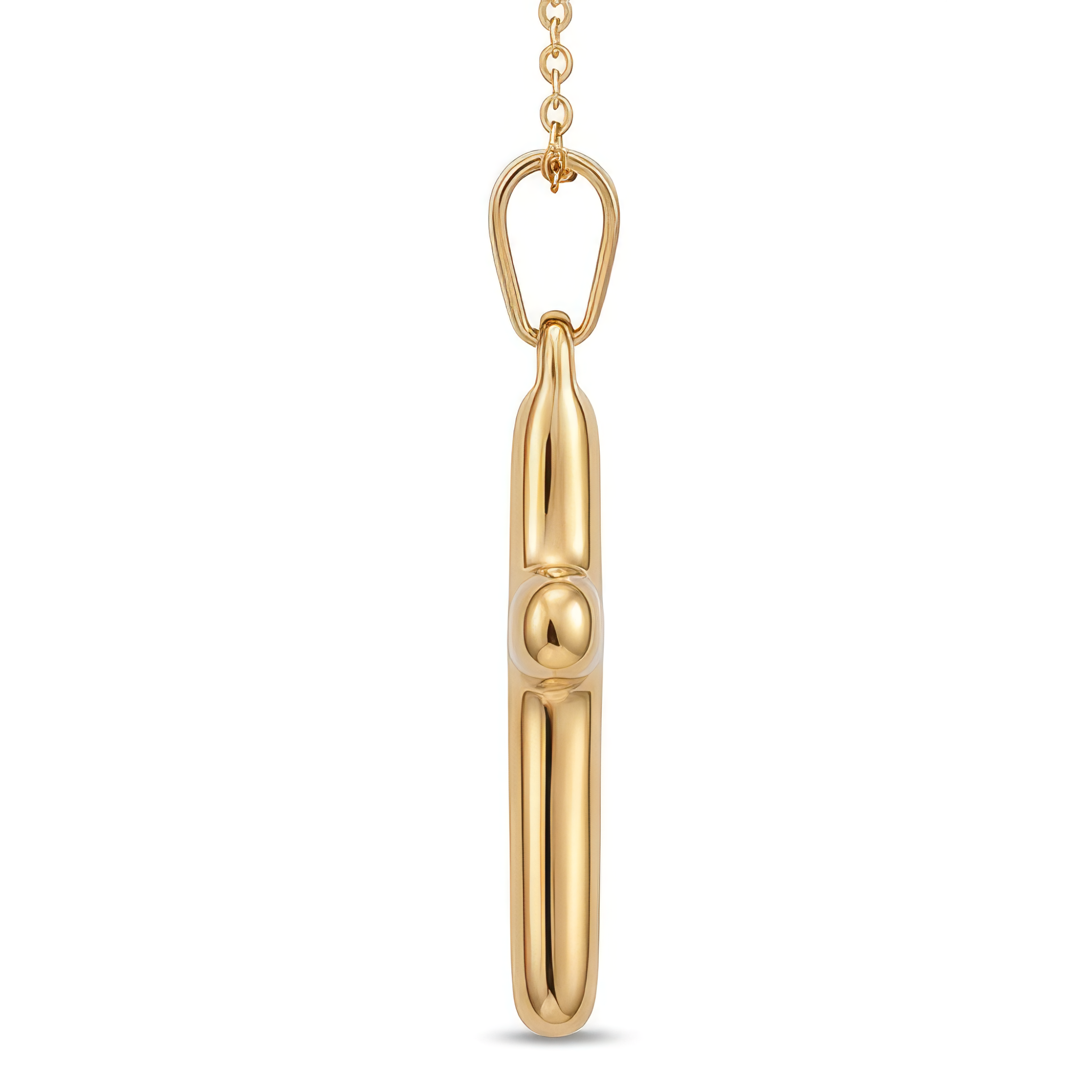 Side view of a gold cross necklace on a white background.
