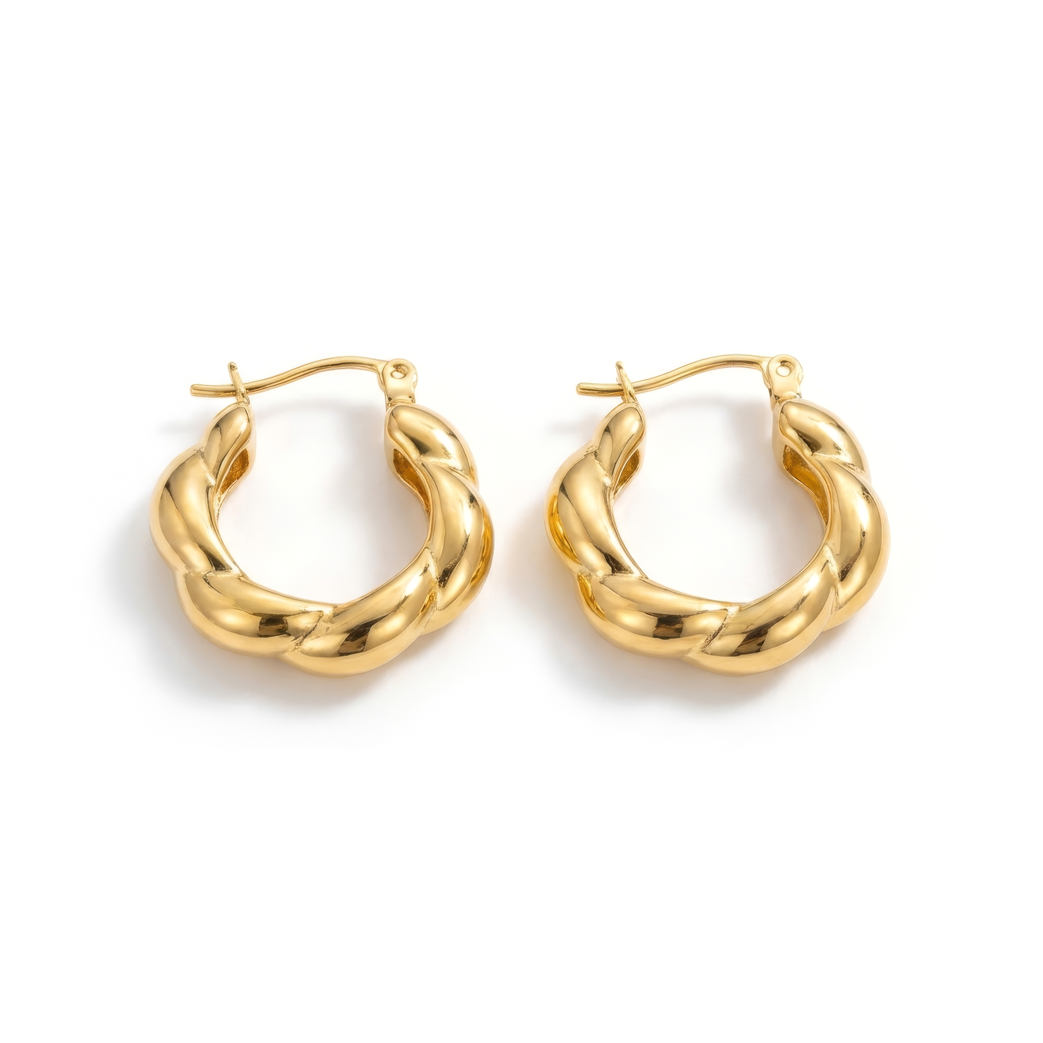 Pair of gold hoop earrings on a white background