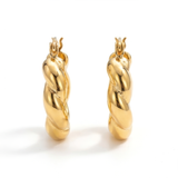 Front view of a pair of gold hoop earrings on a white background