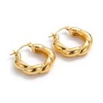 Gold hoop earrings on a white background